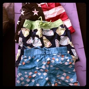 3 Boys swim shirts, flip flops & red sun glasses